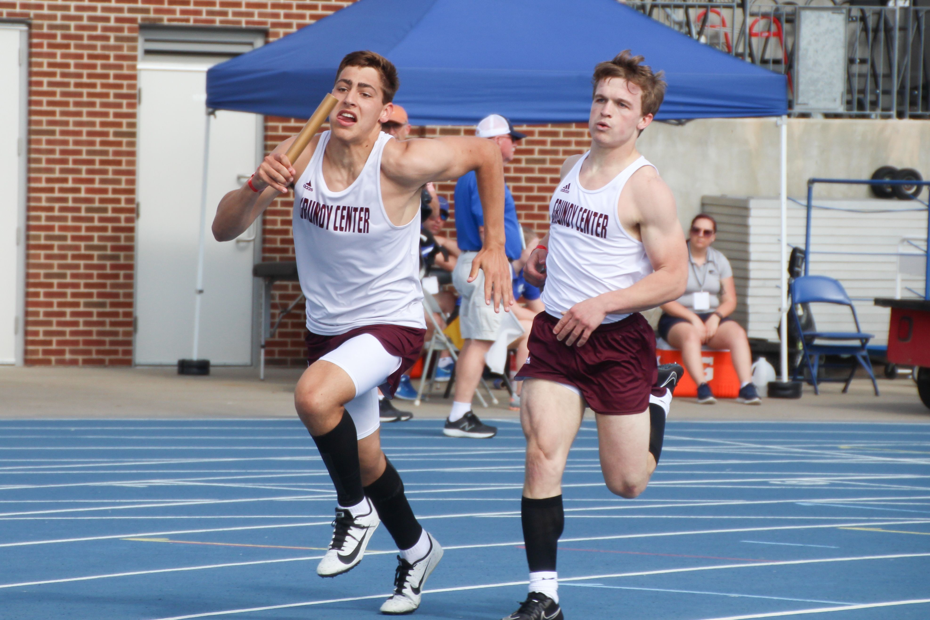Grundy Center boys track and field sprinted to a fifth-place finish in Class 1A at the state meet in 2021. The Spartans had three silver-medal finishes, including Logan Knaack in the 100, the sprint medley relay and the 4x200 relay (pictured with Dayne Zinkula and Matt Jansen, left to right). (Jake Ryder photo)