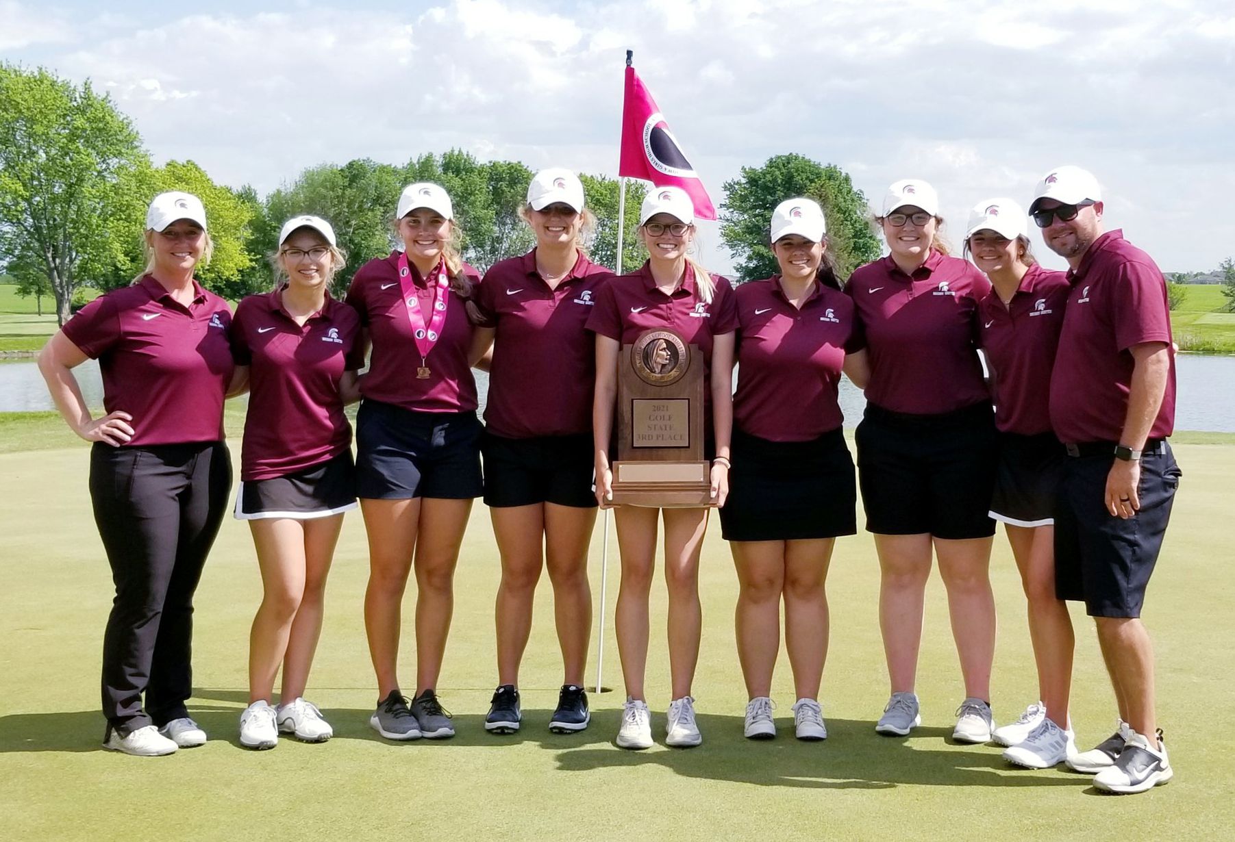 Grundy Center girls golf finished third at the Class 1A state meet in Ames in 2021. Holding the trophy is Lauren Krausman, the Spartans’ only senior on the team. Abbie Lindeman, third from left, was seventh overall as an individual. (Jake Ryder photo)