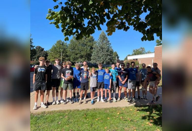 Members of the Glabrook-Reinbeck cross-country team pose in Reinbeck prior to running the homecoming ball 15.6 miles to Gladbrook on Oct 2. (Photo courtesy of DNH School District)