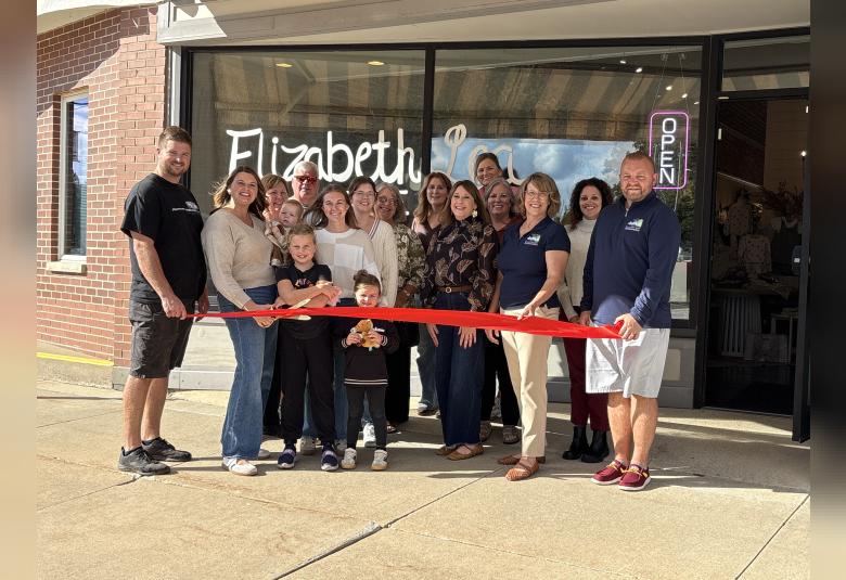 Owner, Katie Lewis and her husband Jordan Lewis and their family cut the ribbon for their Grand Opening of Elizabeth Lea Boutique, named after their children. Photos taken by Michelle Kennedy