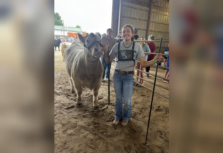 Raegyn Buskhol waiting to show her cow in the next class of the Beef Show.